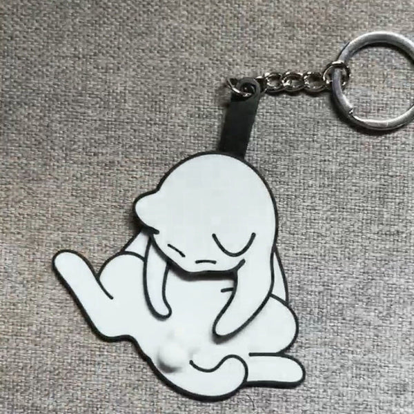 Playing with eggs and kitten keychain